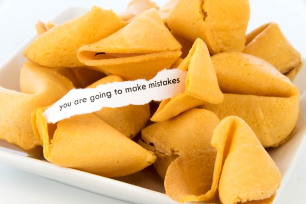 open fortune cookie with strip of white paper - YOU ARE GOING TO MAKE MISTAKES